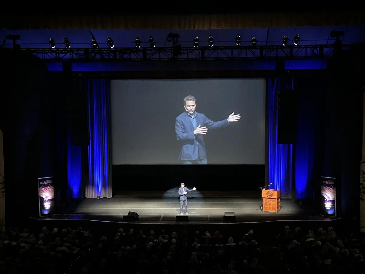 Fareed Zakaria speaking on stage with event audio support from Shadowfax Audio